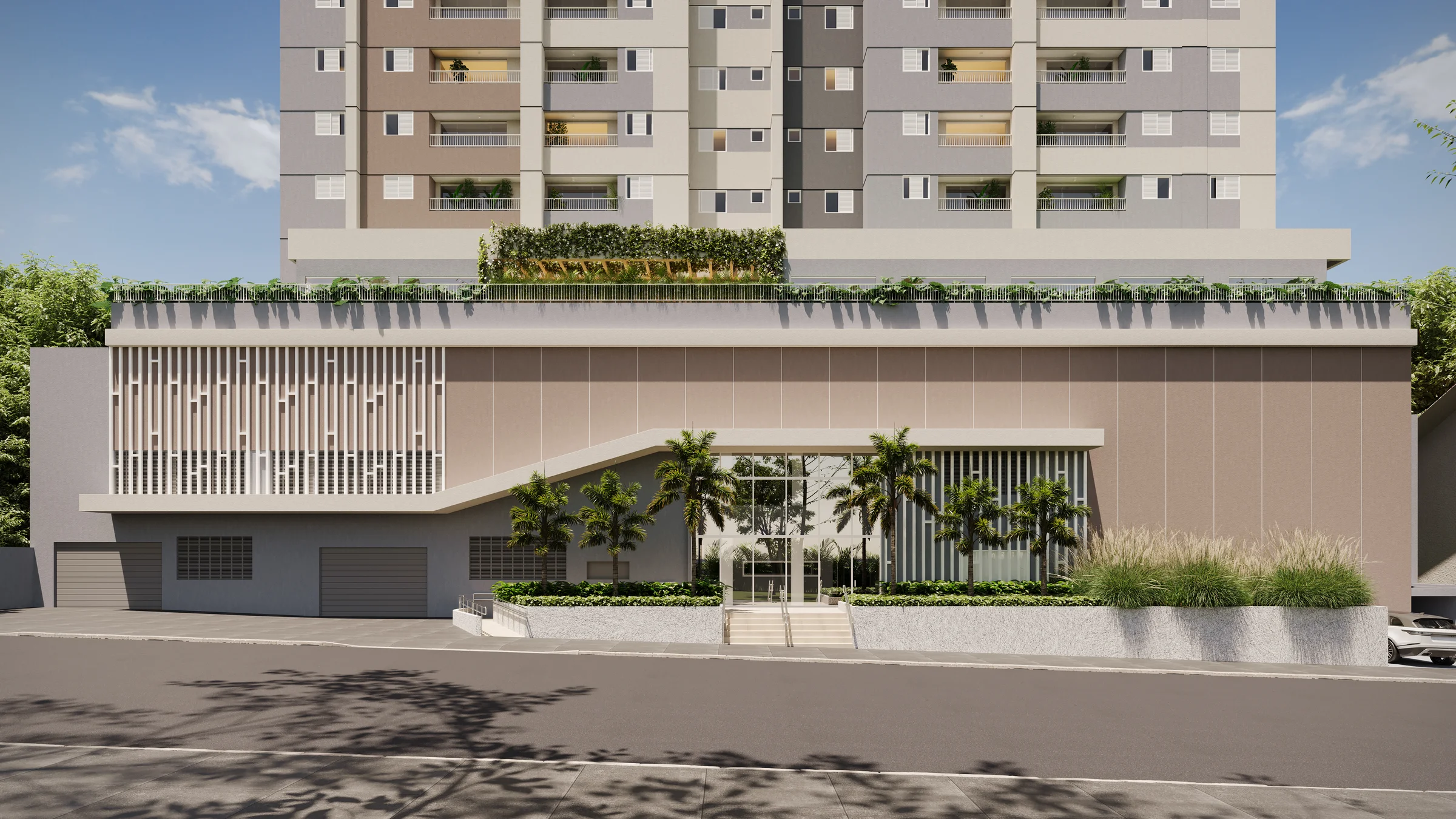 Entrada social do edifício com escadaria de acesso, paisagismo e portaria no nível da rua