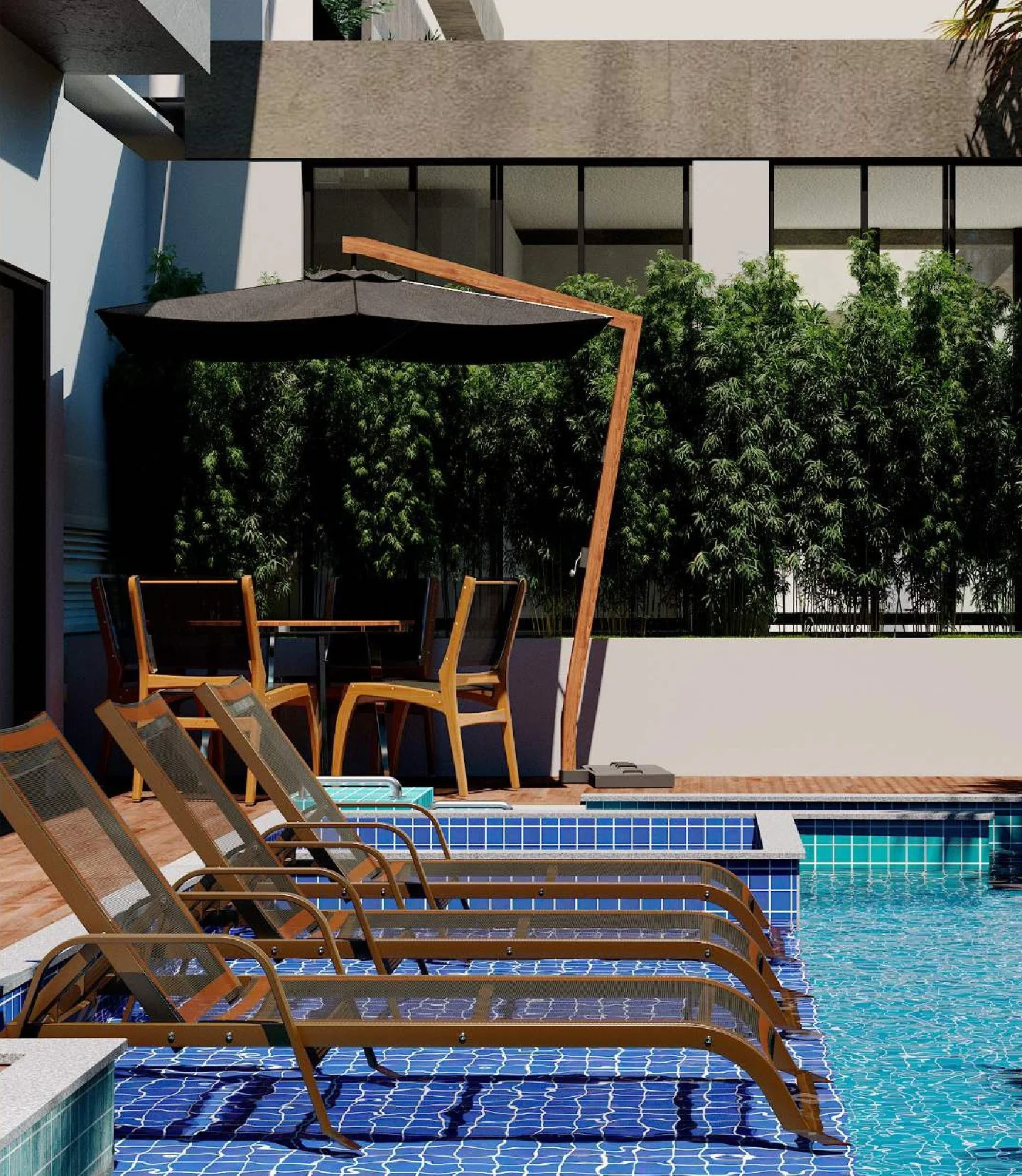 Deck da piscina com espreguiçadeiras na água e conjunto de mesa com ombrelone