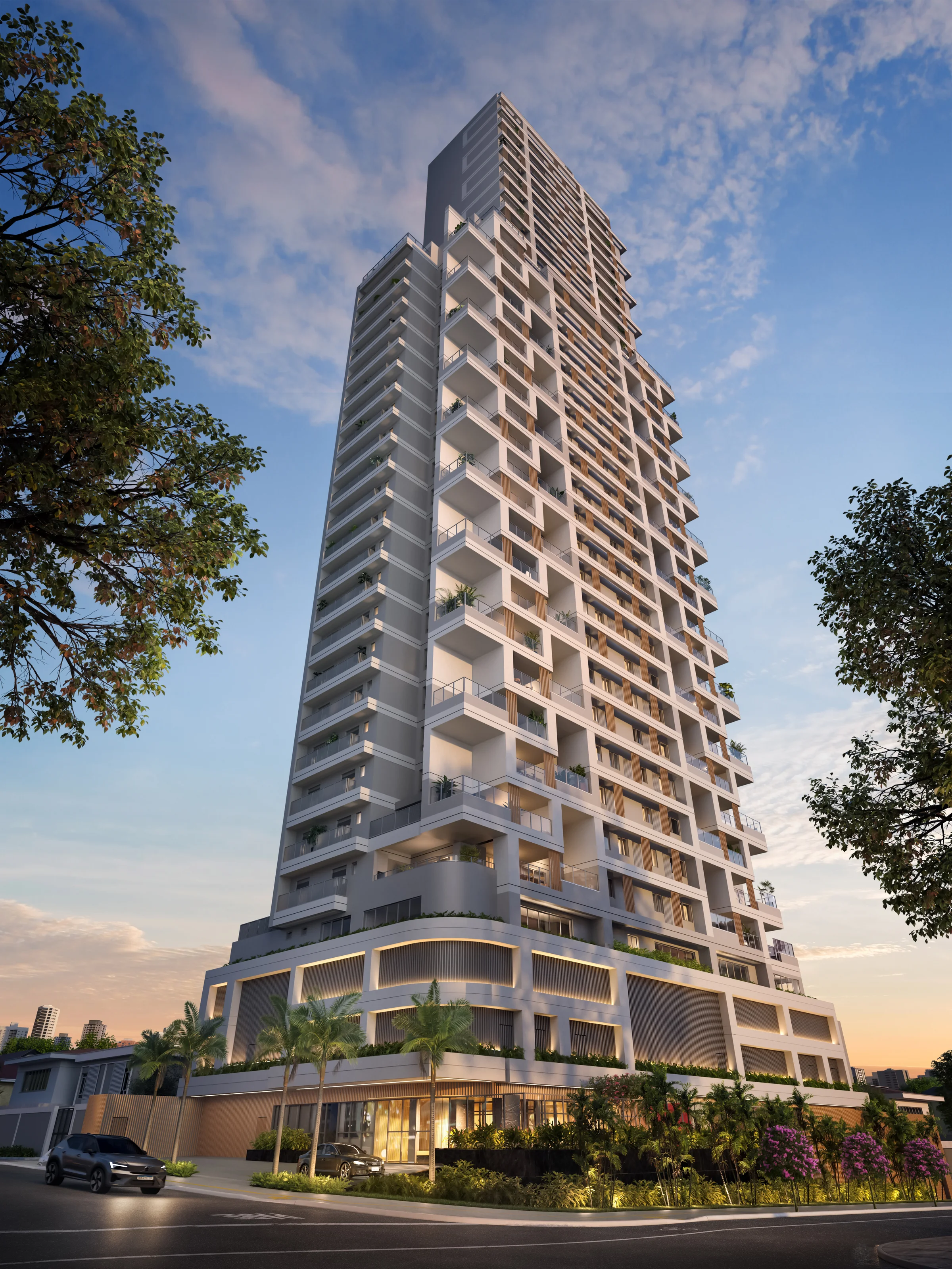 Fachada imponente da torre residencial vista do nível da rua ao entardecer